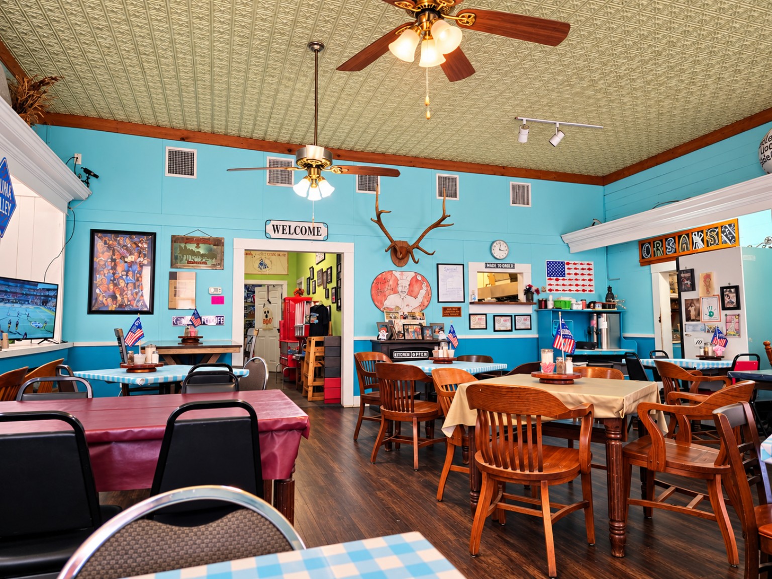 Interior of Orsak’s Café with turquoise walls and tables
